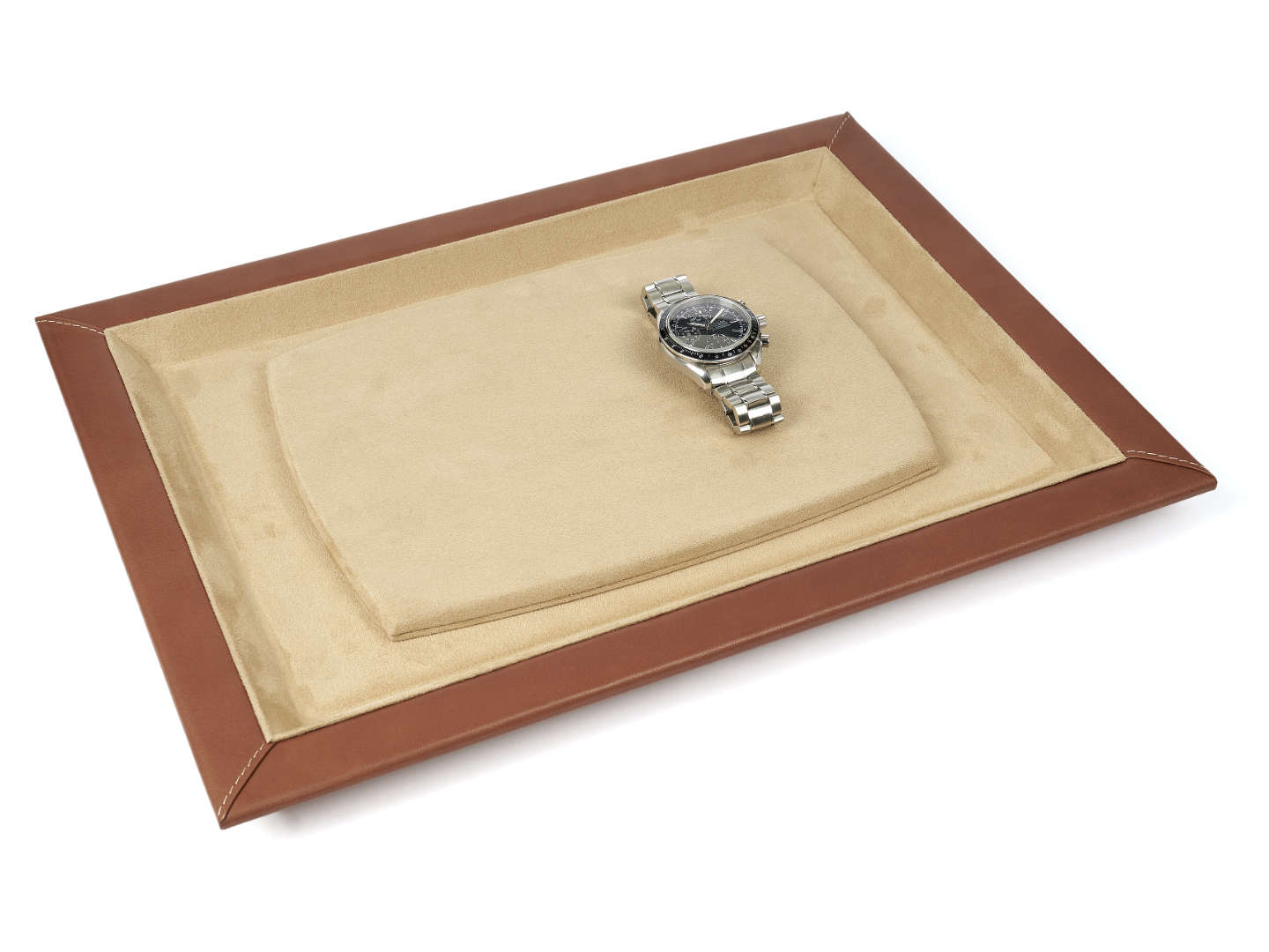 Brown leather watch presentation tray with tan interior and a steel bracelet watch