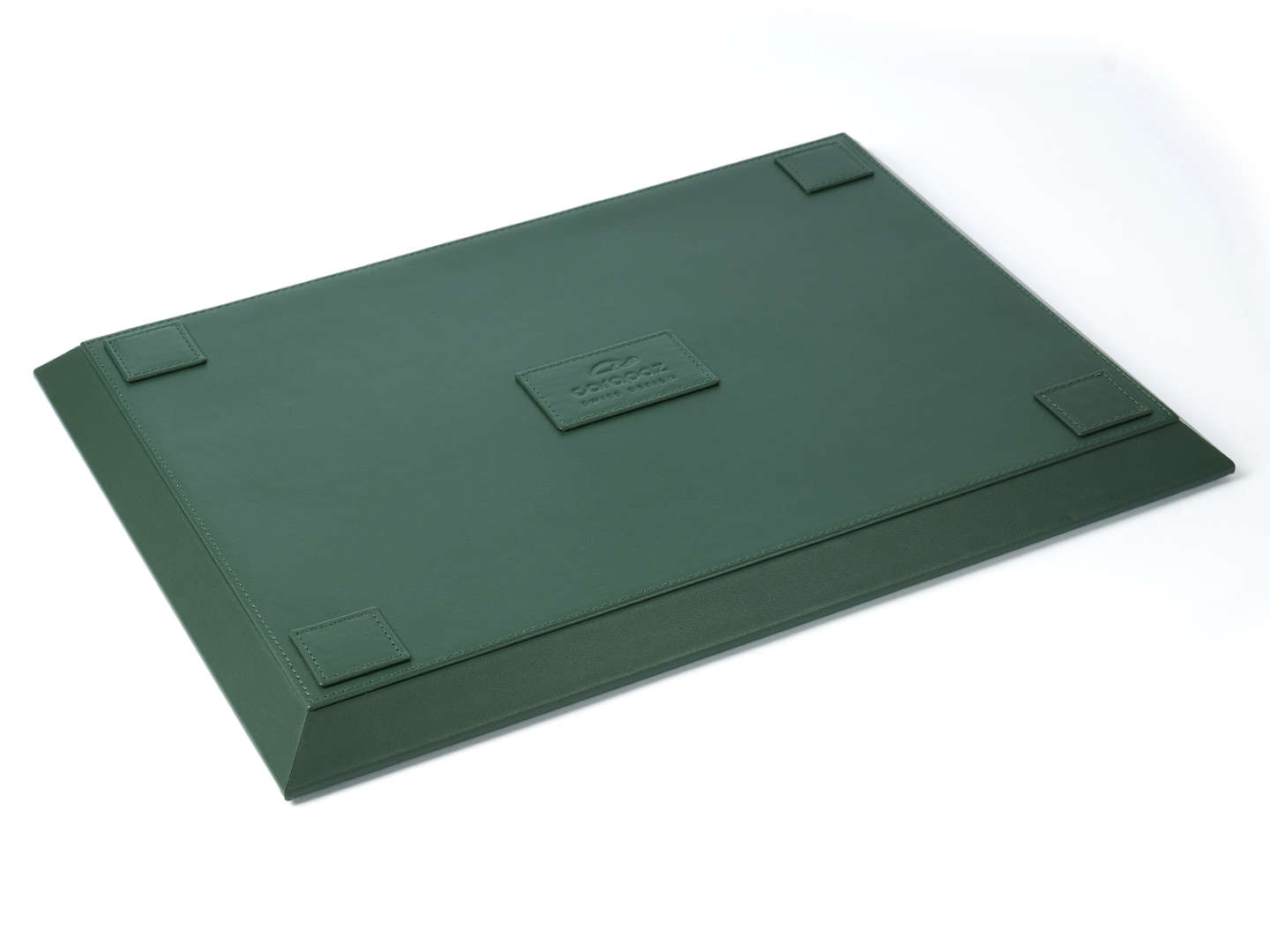 Rear view of a green leather watch tray with embossed Carapaz logo