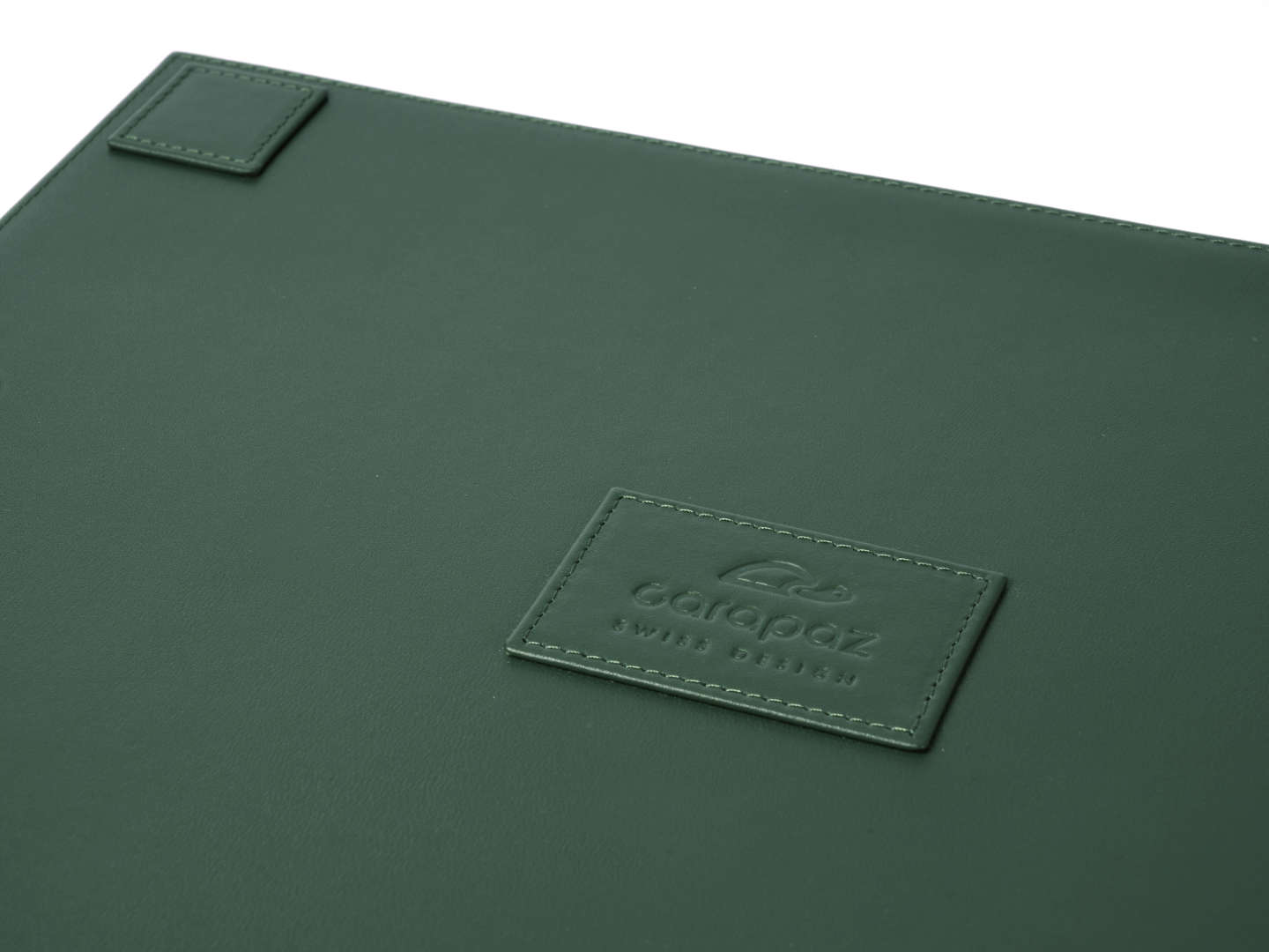 Green watch tray rear view with embossed brand logo by Carapaz