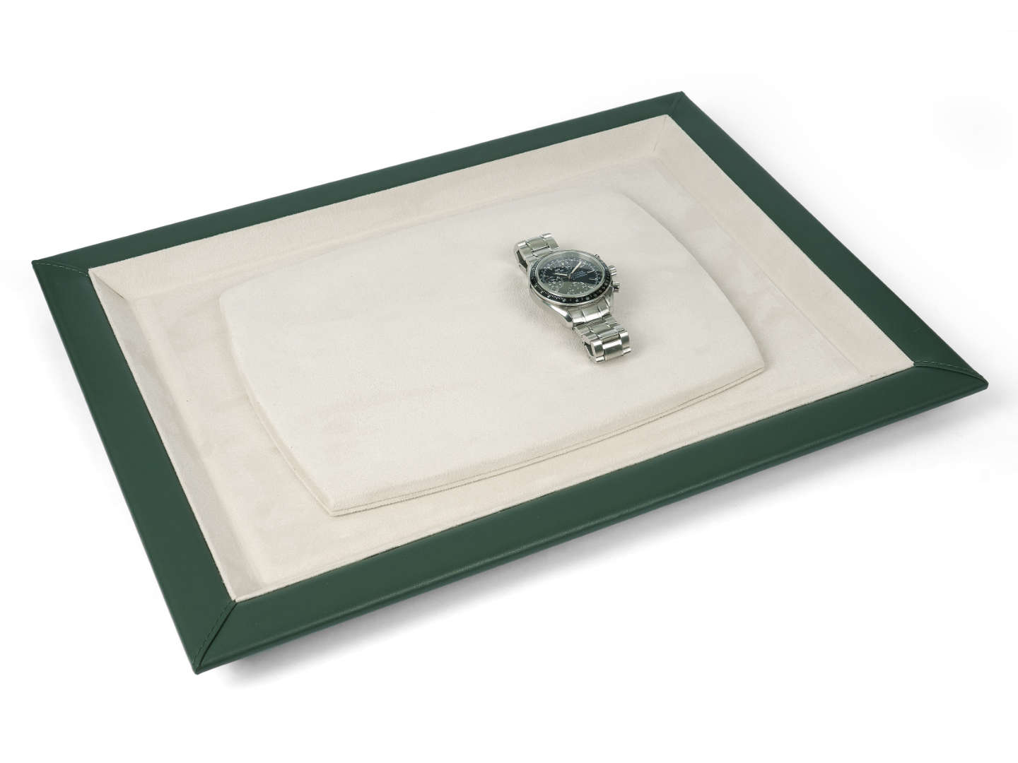 Green leather watch presentation tray with beige interior and 3 watches on it 
